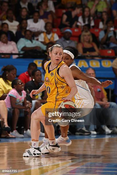 Kristi Harrower of the Los Angeles Sparks handles the ball against Dominique Canty of the Chicago Sky during the WNBA game on July 29, 2009 at the...