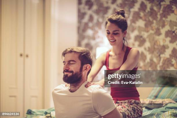 zuhause - husband and wife massage stock-fotos und bilder