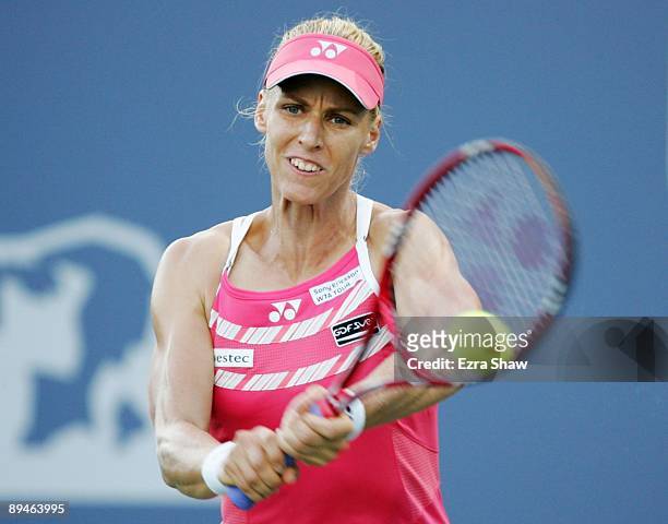Elena Dementieva of Russia returns a shot to Maria Kirilenko of Russia on Day 3 of the Bank of the West Classic at Stanford University on July 29,...