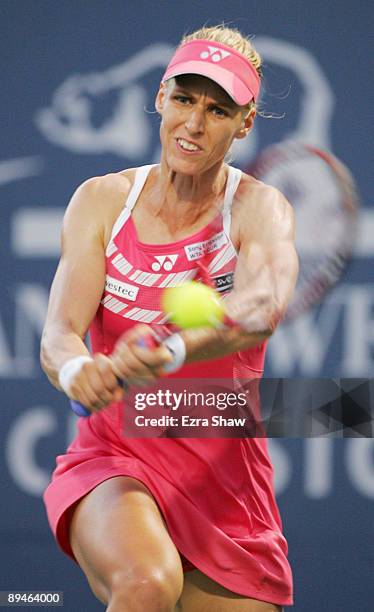 Elena Dementieva of Russia returns a shot to Maria Kirilenko of Russia during their match on Day 3 of the Bank of the West Classic at Stanford...