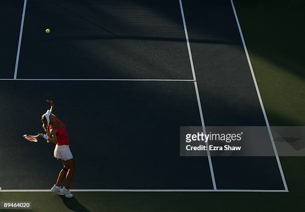 Maria Kirilenko of Russia warms up her serve before playing Elena Dementieva of Russia on Day 3 of the Bank of the West Classic at Stanford...