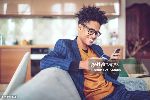 working at home - young men shopping stock pictures, royalty-free photos & images