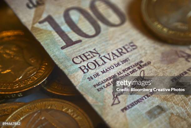 a one-hundred bolivar note - venezuelan bolívar currency stock pictures, royalty-free photos & images