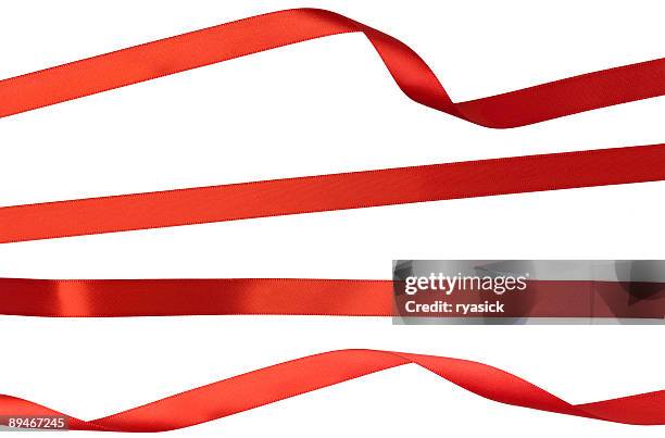 twisted geradeaus und gelockter red ribbon isoliert auf weiße streifen - christmas ribbon stock-fotos und bilder