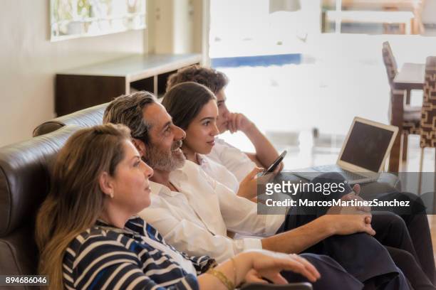happy adult man in living room with family at leisure time - lypsesp17 stock pictures, royalty-free photos & images