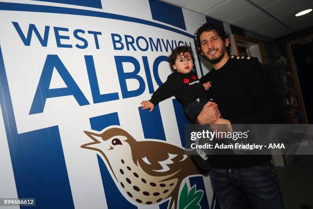 Ahmed Hegazi of West Bromwich Albion and his son after signing a contract that makes his loan move permanent on December 18, 2017 in West Bromwich,...