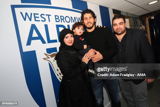 Ahmed Hegazi of West Bromwich Albion and his wife and son after signing a contract that makes his loan move permanent on December 18, 2017 in West...