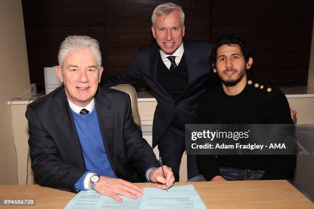 John Williams Chairman of West Bromwich Albion puts pen to paper as Ahmed Hegazi of West Bromwich Albion signs his contract to make his loan move...