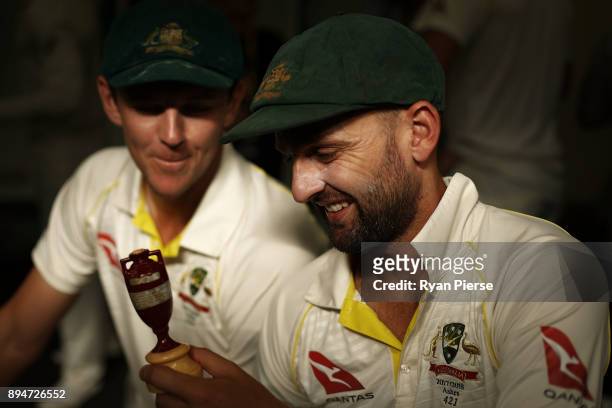 Nathan Lyon and Josh Hazlewood of Australia celebrate in the changerooms after Australia regained the Ashes during day five of the Third Test match...