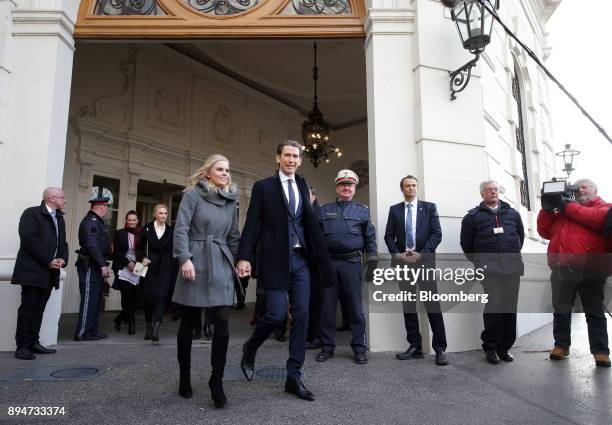 Sebastian Kurz, Austria's chancellor, center right, and his partner Susanne Thier, depart following the inauguration of the new federal government in...