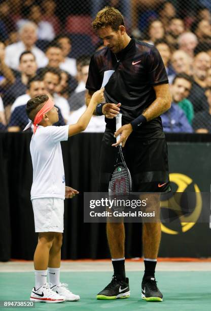 Juan Martin Del Potro talks with a child during an exhibition match between Juan Martin Del Potro and Nick Kyrgios at Luna Park on December 15, 2017...