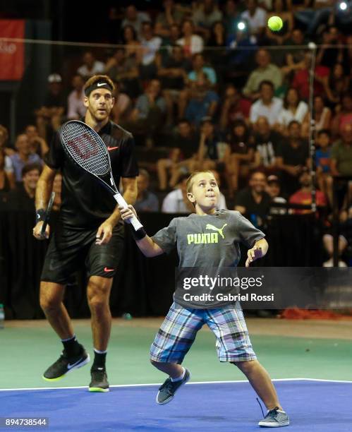 Juan Martin Del Potro of Argentina plays with a child during an exhibition match between Juan Martin Del Potro and Nick Kyrgios at Luna Park on...