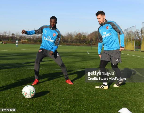 Eddie Nketiah and Mathieu Debuchy of Arsenal during a training session at London Colney on December 18, 2017 in St Albans, England.