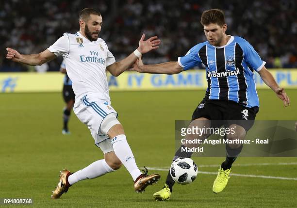 Karim Benzema of Real Madrid competes for the ball with Walter Kannemann of Gremio during the FIFA Club World Cup UAE 2017 Final match between Real...