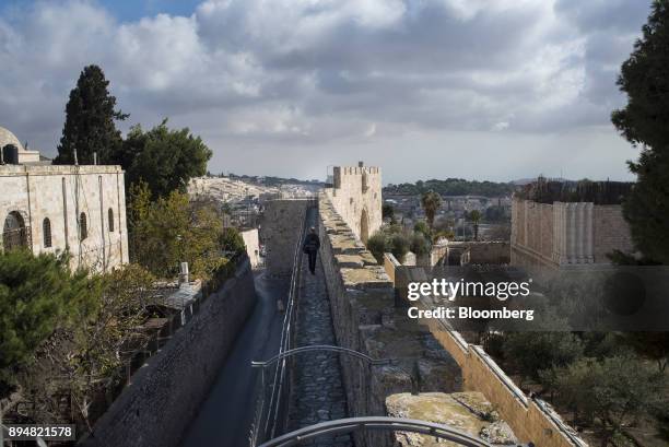 Man walks along the ramparts of the Old City wall in Jerusalem, Israel, on Thursday, Dec. 14, 2017. The United Nations Security Council is expected...