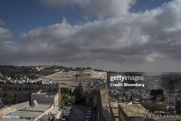The ramparts of the Old City walls stand beneath the Mount of Olives cemetery in Jerusalem, Israel, on Thursday, Dec. 14, 2017. The United Nations...