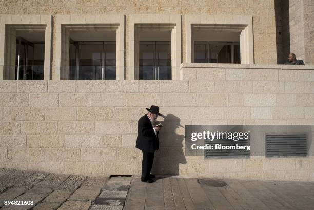 Jewish man prays at the Western Wall Plaza in Jerusalem, Israel, on Thursday, Dec. 14, 2017. The United Nations Security Council is expected to vote...