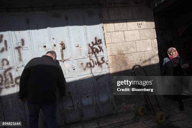 Man opens his shop in the Christian quarter of the Old City in Jerusalem, Israel, on Saturday, Dec. 16, 2017. The United Nations Security Council is...