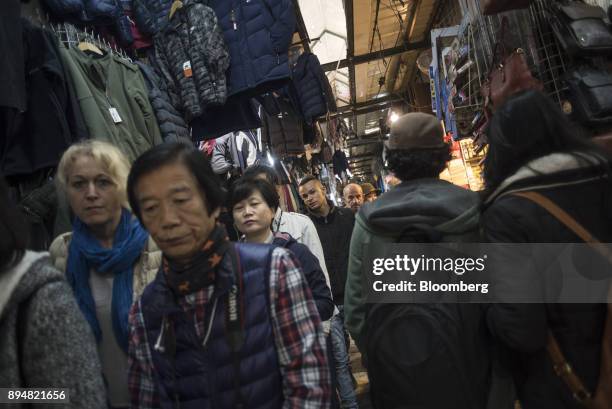 Tourists and locals walk through the Arab souq in the Old City in Jerusalem, Israel, on Saturday, Dec. 16, 2017. The United Nations Security Council...