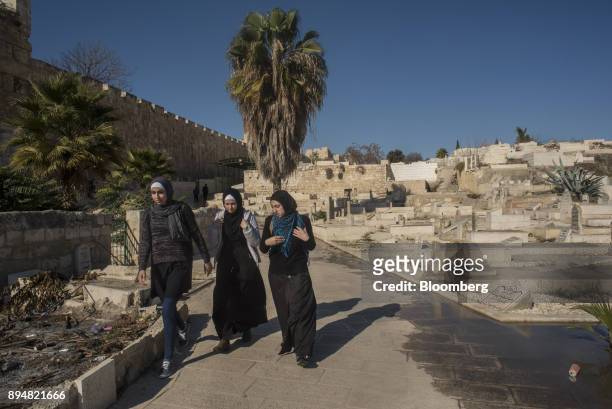 Muslim girls walk along the Old City walls outside Lions Gate in Jerusalem, Israel, on Saturday, Dec. 16, 2017. The United Nations Security Council...