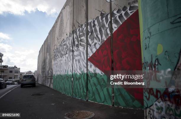 Palestinian flag graffiti mural sits on a section of the Israeli West Bank security barrier wall at the Aida refugee camp in Bethlehem, Israel, on...