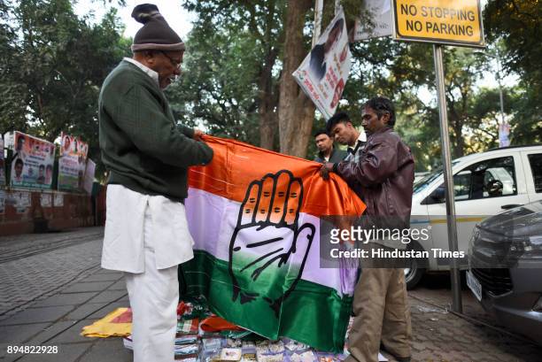 Vendor sells congress flags on almost empty street outside Congress party headquarters after trends project loss for party in Gujarat and Himachal...