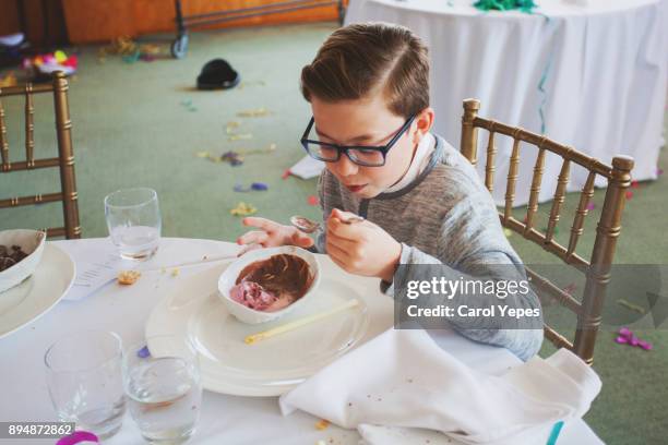 boy eats ice chocolate in a restaurant - pie face stock pictures, royalty-free photos & images