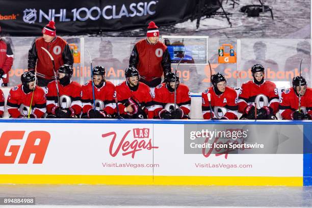 Ottawa Senators Head Coach Guy Boucher behind the bench during NHL 100 Classic first period National Hockey League action between the Montreal...