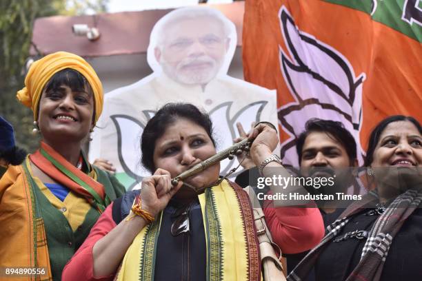 Worker and supporters celebrate after winning Gujarat and Himachal Pradesh Election 2017 at BJP HQ on December 18, 2017 in New Delhi, India. The...