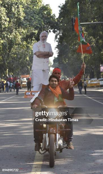 Worker and supporters celebrate after winning Gujarat and Himachal Pradesh Election 2017 at BJP HQ on December 18, 2017 in New Delhi, India. The...