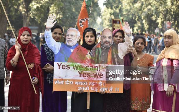 Worker and supporters celebrate after winning Gujarat and Himachal Pradesh Election 2017 at BJP HQ on December 18, 2017 in New Delhi, India. The...