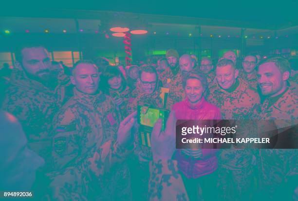 German Defence Minister Ursula von der Leyen makes photos with soldiers during the Christmas market at Camp Marmal in Mazar-i-Sharif, northern...