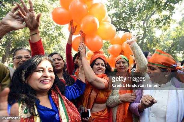 Worker and supporters celebrate after winning Gujarat and Himachal Pradesh Election 2017 at BJP HQ on December 18, 2017 in New Delhi, India. The...