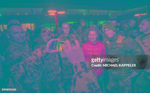 German Defence Minister Ursula von der Leyen makes photos with soldiers during the Christmas market at Camp Marmal in Mazar-i-Sharif, northern...