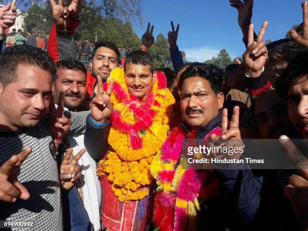 Candidate from Nachan assembly seat Vinod Kumar celebrates with supporters after win on December 18, 2017 of Mandi, India. In Himachal Pradesh...