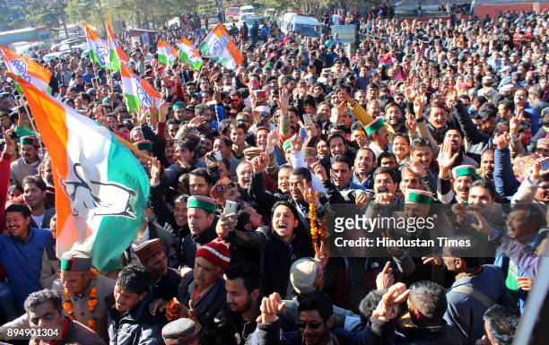 Congress candidate from Kullu Sadar Sundar Singh Thakur celebrates with supporters after win on December 18, 2017 in Kullu, India. In Himachal...