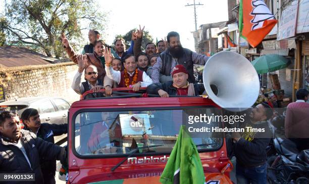 Candidate from Dharamsala Kishan Kapoor celebrates with his supporters outside a counting center on December 18, 2017 in Dharmsala, India.