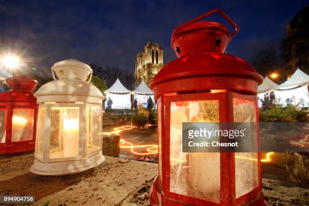 Light lanterns are seen in a Christmas market located near Notre-Dame Cathedral as the French capital prepares for the Christmas holiday season on...