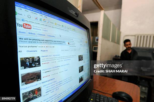 Afghanistan-vote-Internet-media,FOCUS by Charlotte McDonald-Gibson An Afghan man sits beside a computer displaying images from 'You Tube' on the...