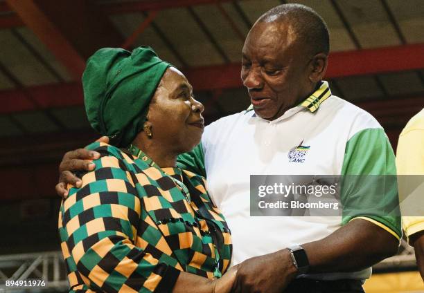 Cyril Ramaphosa, South Africa's deputy president and newly elected president of the African National Congress party , right, embraces opponent...