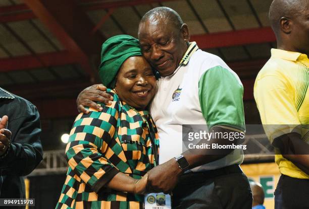 Cyril Ramaphosa, South Africa's deputy president and newly elected president of the African National Congress party , right, embraces opponent...