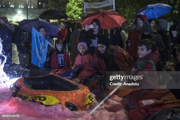 People gather at Sintagma Square during the International Migrants Day to protest the Migrant deaths in Mediterranean and Migrant issues in Libya in...