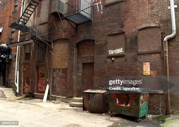 dark alley in a downtown urban area - alley stock pictures, royalty-free photos & images