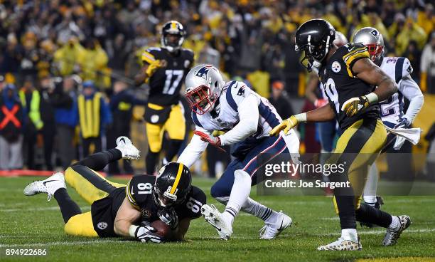 Jesse James of the Pittsburgh Steelers dives for the end zone for an apparent touchdown in the fourth quarter during the game against the New England...