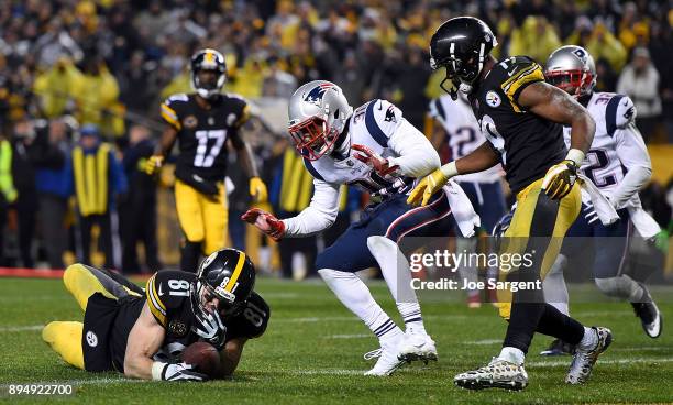 Jesse James of the Pittsburgh Steelers dives for the end zone for an apparent touchdown in the fourth quarter during the game against the New England...