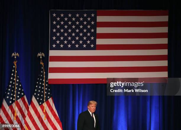 President Donald Trump walks off stage after delivering a speech at the Ronald Reagan Building December 18, 2017 in Washington, DC. The president was...