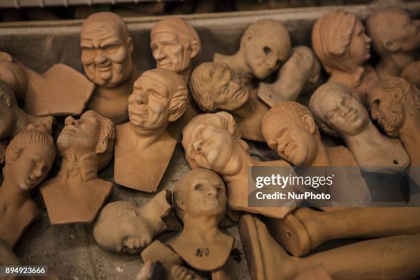 Various sculptures being sold in Via San Gregorio Armeno, a street famous for its artisan shops selling nativity displays in Naples, Italy on...