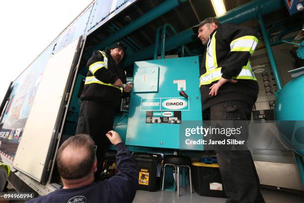 Members of the ice crew work near the Ice Plant Truck as it Arrives at Citi Field for the start of the rink build process ahead of the 2018...