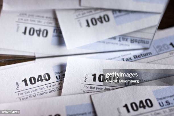 Department of the Treasury Internal Revenue Service 1040 Individual Income Tax forms for the 2016 tax year are arranged for a photograph in Tiskilwa,...