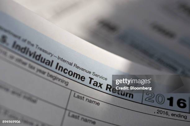 Department of the Treasury Internal Revenue Service 1040 Individual Income Tax forms for the 2016 tax year are arranged for a photograph in Tiskilwa,...